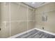 Walk-in closet with custom white metal shelving and gray wood-style floors at 110 Instructor Ct, Ladson, SC 29456
