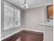 Breakfast nook with natural light and hardwood flooring, adjacent to a modern kitchen at 110 Instructor Ct, Ladson, SC 29456