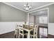 Inviting dining room with a modern chandelier and seating for six for Gathering dinners at 110 Instructor Ct, Ladson, SC 29456