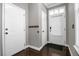 Bright foyer featuring hardwood floors, white doors, and a window for natural light at 110 Instructor Ct, Ladson, SC 29456