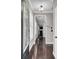 Hallway with dark hardwood floors, neutral walls, and white trim at 110 Instructor Ct, Ladson, SC 29456