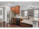 Modern kitchen showcasing stainless steel appliances, granite countertops, and hardwood floors at 110 Instructor Ct, Ladson, SC 29456