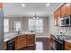 Well-lit kitchen with granite countertops, stainless steel appliances and a breakfast area at 110 Instructor Ct, Ladson, SC 29456
