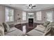 Bright living room featuring hardwood floors, lots of natural light, and a cozy fireplace at 110 Instructor Ct, Ladson, SC 29456