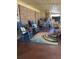 Inviting back porch with colorful rug and comfortable rocking chairs at 111 Newington Rd, Summerville, SC 29485