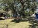 Overhead view of a well-maintained backyard with brick patio and shade trees at 111 Newington Rd, Summerville, SC 29485