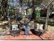 Backyard patio with wicker chairs and decorative accents, creating a charming outdoor living space at 111 Newington Rd, Summerville, SC 29485