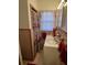 Cozy bathroom features vintage-style tiles, vanity, and a bright window with a floral shower curtain at 111 Newington Rd, Summerville, SC 29485