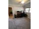 Bedroom featuring a large window, dark wooden desk and office chair, and neutral walls and carpet at 111 Newington Rd, Summerville, SC 29485