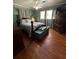 Comfortable bedroom with a four-poster bed, hardwood floors, and green walls at 111 Newington Rd, Summerville, SC 29485