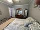 Relaxing bedroom featuring neutral walls, wood floors, and a comfortable bed with patterned pillows at 111 Newington Rd, Summerville, SC 29485