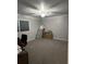 Spacious bedroom with neutral gray walls, carpet and filled with unpacked boxes and furniture at 111 Newington Rd, Summerville, SC 29485