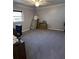 Spacious bedroom with neutral gray walls, carpet and filled with unpacked boxes and furniture at 111 Newington Rd, Summerville, SC 29485