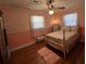 Bright bedroom showcasing natural light, hardwood floors, and a comfortable bed with floral accents at 111 Newington Rd, Summerville, SC 29485