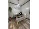 The dining area features a charming bench seat, black table, and decorative accents at 111 Newington Rd, Summerville, SC 29485