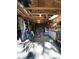 Interior view of the garage with work benches, tools hanging from walls and multiple ceiling lights at 111 Newington Rd, Summerville, SC 29485