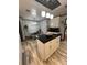 Open kitchen area with island, modern appliances, and adjacent banquette seating at 111 Newington Rd, Summerville, SC 29485