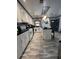Well-lit kitchen with stainless steel appliances, center island, and modern backsplash at 111 Newington Rd, Summerville, SC 29485