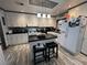 Modern kitchen featuring stainless steel appliances, island with breakfast bar, and stylish countertops at 111 Newington Rd, Summerville, SC 29485