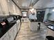 Bright kitchen with stainless steel appliances, a center island, and ample cabinet space at 111 Newington Rd, Summerville, SC 29485