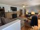 Inviting living room boasts a brick fireplace and hardwood floors with cozy seating at 111 Newington Rd, Summerville, SC 29485