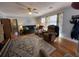 Bright living room features hardwood floors, ample light, and comfortable seating at 111 Newington Rd, Summerville, SC 29485