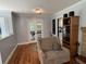 Open living room adjacent to kitchen with hardwood floors, fireplace, and lots of seating at 111 Newington Rd, Summerville, SC 29485