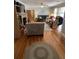 Comfortable living room with hardwood floors, natural lighting, fireplace, and cozy seating at 111 Newington Rd, Summerville, SC 29485