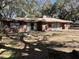 Classic red brick home with mature trees and a large yard at 111 Newington Rd, Summerville, SC 29485