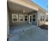 Covered back porch with a ceiling fan and multiple windows at 113 Doral Blue Dr, Summerville, SC 29483