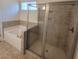 Bathroom featuring a tub and tiled glass shower at 113 Doral Blue Dr, Summerville, SC 29483