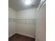 Walk-in closet with wood floors and wire shelving for storage at 113 Doral Blue Dr, Summerville, SC 29483
