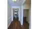 Bright hallway with wood floors, white trim, and high ceilings at 113 Doral Blue Dr, Summerville, SC 29483