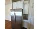 Stainless steel refrigerator with white cabinets and granite countertop at 113 Doral Blue Dr, Summerville, SC 29483