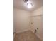 Compact laundry room with tile flooring and installed shelving at 113 Doral Blue Dr, Summerville, SC 29483