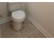 Bathroom featuring a white toilet and neutral tile flooring at 113 Doral Blue Dr, Summerville, SC 29483