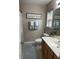 Cozy bathroom with wood vanity, neutral paint and decor, and natural light at 120 Hornby Cir, Goose Creek, SC 29445