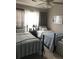 Bedroom with two twin beds, soft blue linens, and a ceiling fan at 120 Hornby Cir, Goose Creek, SC 29445