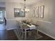 Well-decorated dining area with a chandelier, feather artwork, and a dining table with seating for four at 120 Hornby Cir, Goose Creek, SC 29445