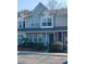 Charming two-story townhouse with light blue siding, white trim, and well-maintained landscaping at 120 Hornby Cir, Goose Creek, SC 29445