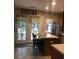 Cozy kitchen with a breakfast bar, black bar stools, and a view to the outdoor dining area at 120 Hornby Cir, Goose Creek, SC 29445