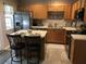 Bright kitchen with stainless steel appliances, wooden cabinets, and a center island with seating at 120 Hornby Cir, Goose Creek, SC 29445
