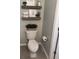 Neat bathroom featuring a white toilet, decorative shelves, and neutral wall paint at 120 Hornby Cir, Goose Creek, SC 29445
