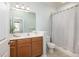 Bright bathroom with a large mirror, vanity with cabinet storage, and shower-tub combo at 1225 Blakeway St # 403, Charleston, SC 29492