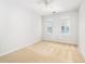 An empty bedroom featuring neutral paint, carpet flooring, and two windows for natural light at 1225 Blakeway St # 403, Charleston, SC 29492