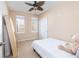 Cozy bedroom with natural light, a ceiling fan, and a comfortable bed with a stuffed animal at 1225 Blakeway St # 403, Charleston, SC 29492