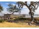 Picturesque waterfront view featuring a wooden dock with a gazebo and beautiful tree overlooking the water at 1225 Blakeway St # 403, Charleston, SC 29492