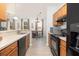 Kitchen with stainless steel appliances, light counter tops, and an adjacent dining area at 1225 Blakeway St # 403, Charleston, SC 29492