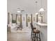 Bright living room with light walls and floors, bar seating, and comfortable furnishings at 1225 Blakeway St # 403, Charleston, SC 29492