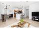 Open-concept space with a spacious living room, dining area, and kitchen with bar stool seating at 1225 Blakeway St # 403, Charleston, SC 29492